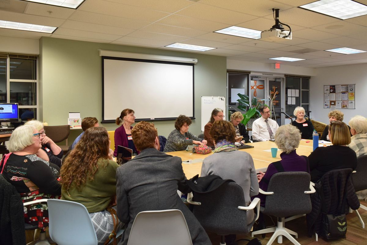 small business owners sitting around a table discussing opportunities and challenges