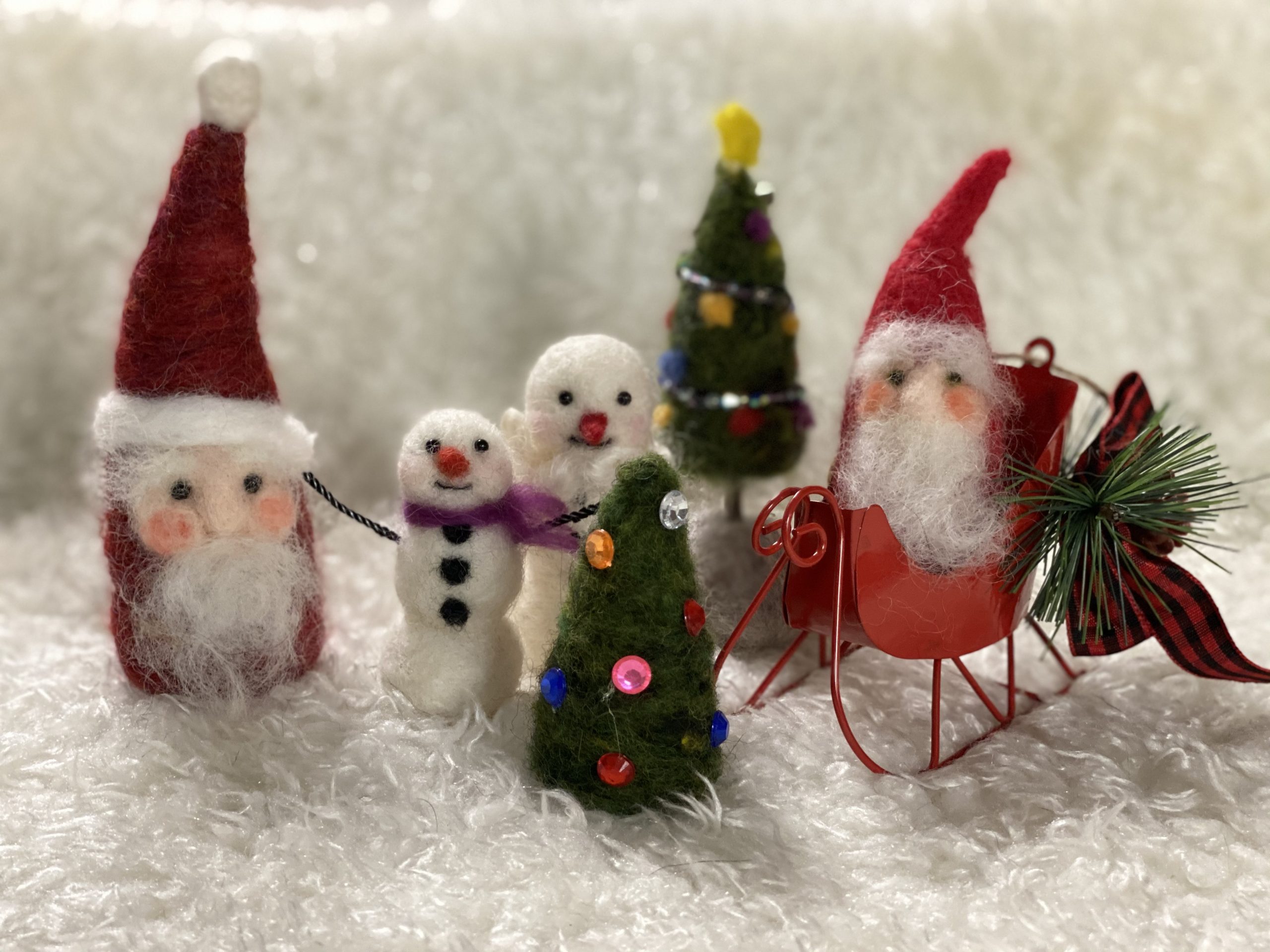 miniature needle-felted santa and snowmen